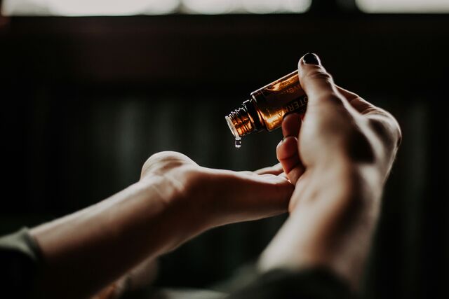 Massage oil poured into a hand